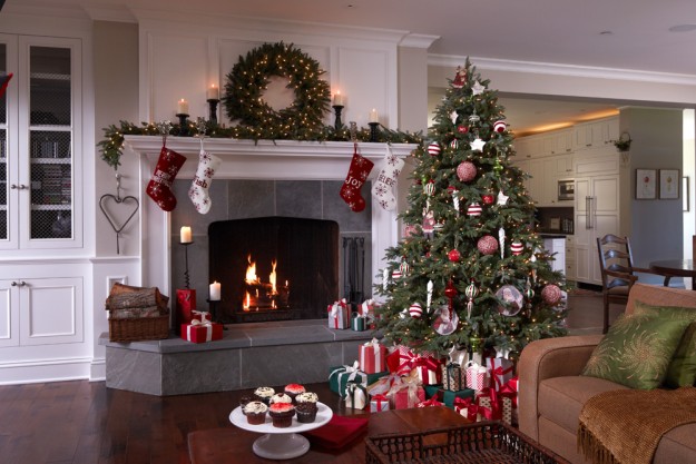 decorated artificial christmas tree, wreath and garland in a transitional style home