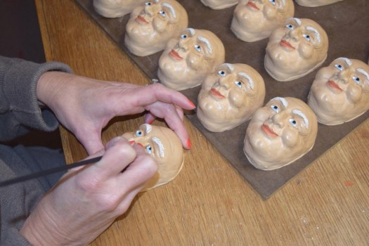Meticulously hand-painted Santa faces