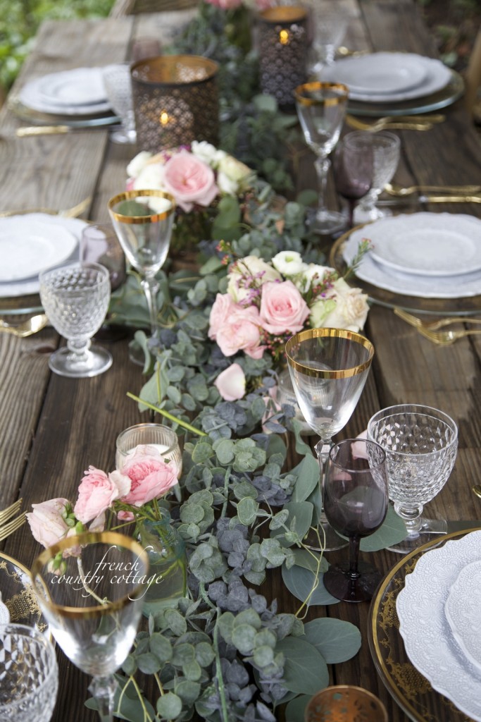 balsam hill faux garland as centerpiece on rustic wooden table 