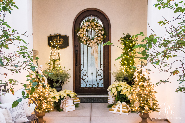 Porch decorated with artificial wreath and garlands