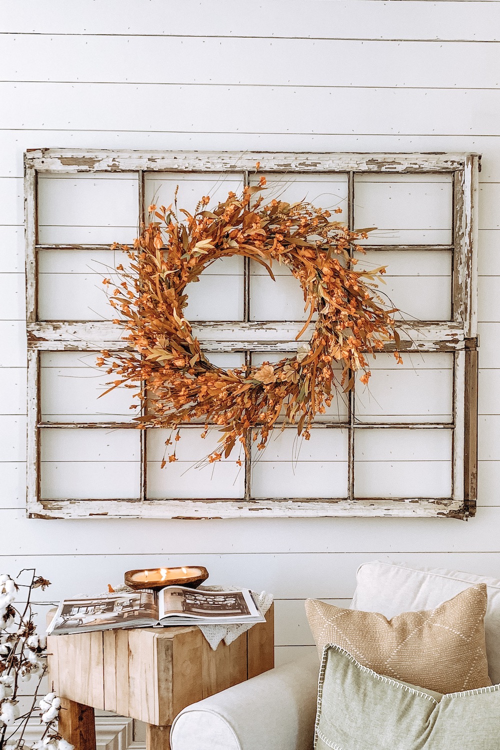 Balsam Hill’s Sunset Meadow Artificial Fall Wreath in a window frame