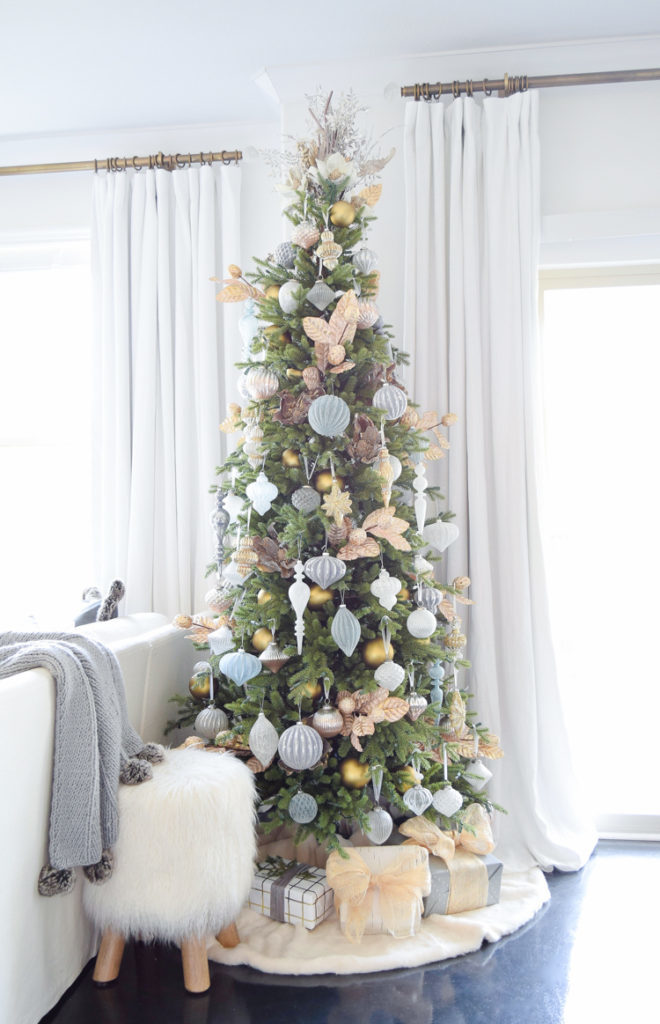 An artificial Christmas tree adorned with assorted ornaments