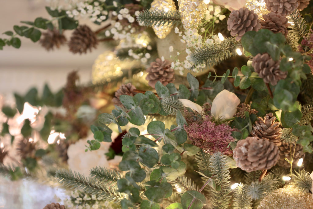Summer Christmas tree decorated with flowers, pinecones, eucalyptus leaves, and Grand Forest ornaments