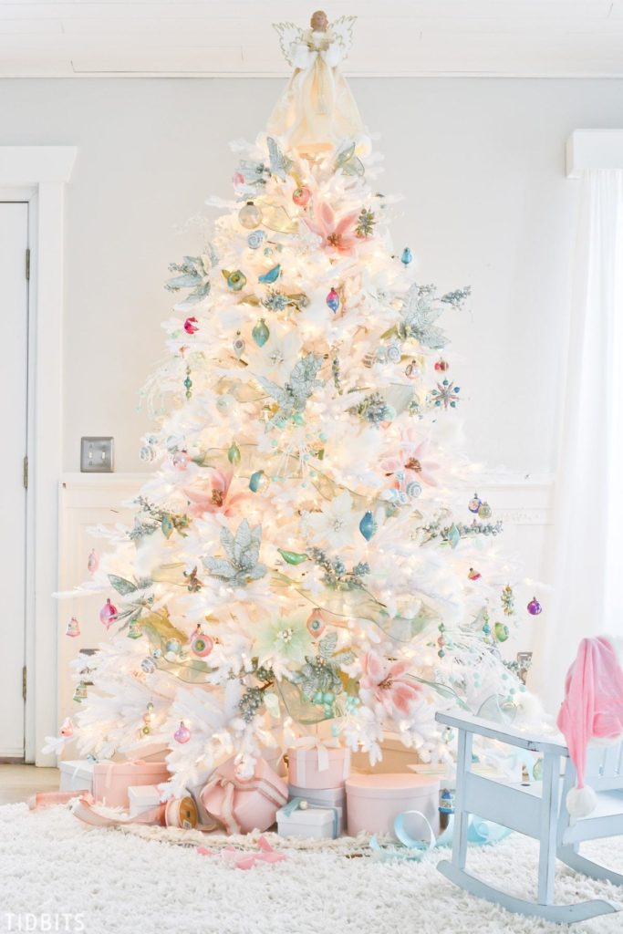 full shot of white christmas tree with pastel decor