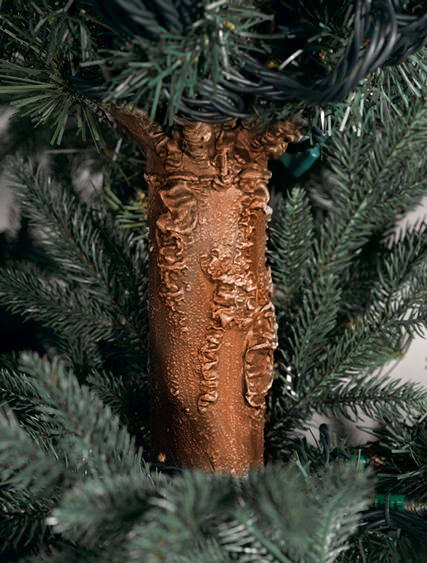 Closeup shot of the trunk of an artificial Christmas tree