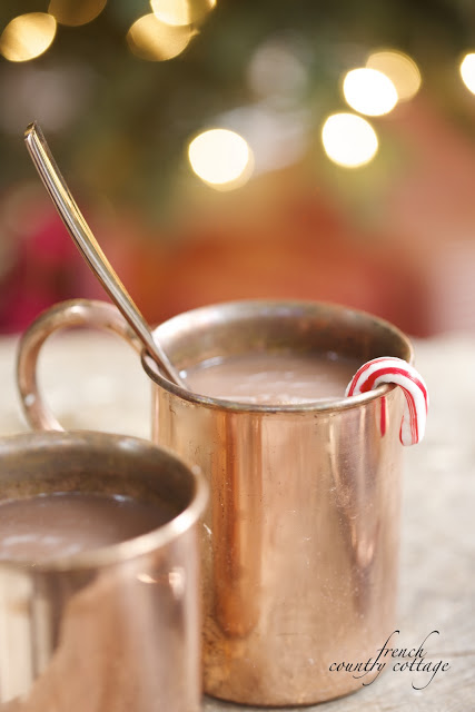 Closeup shot of two copper mugs filled with hot cocoa