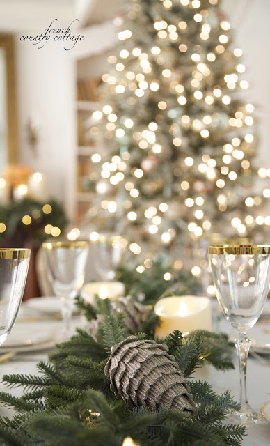 Formal table set up with pinecones and evergreen foliage