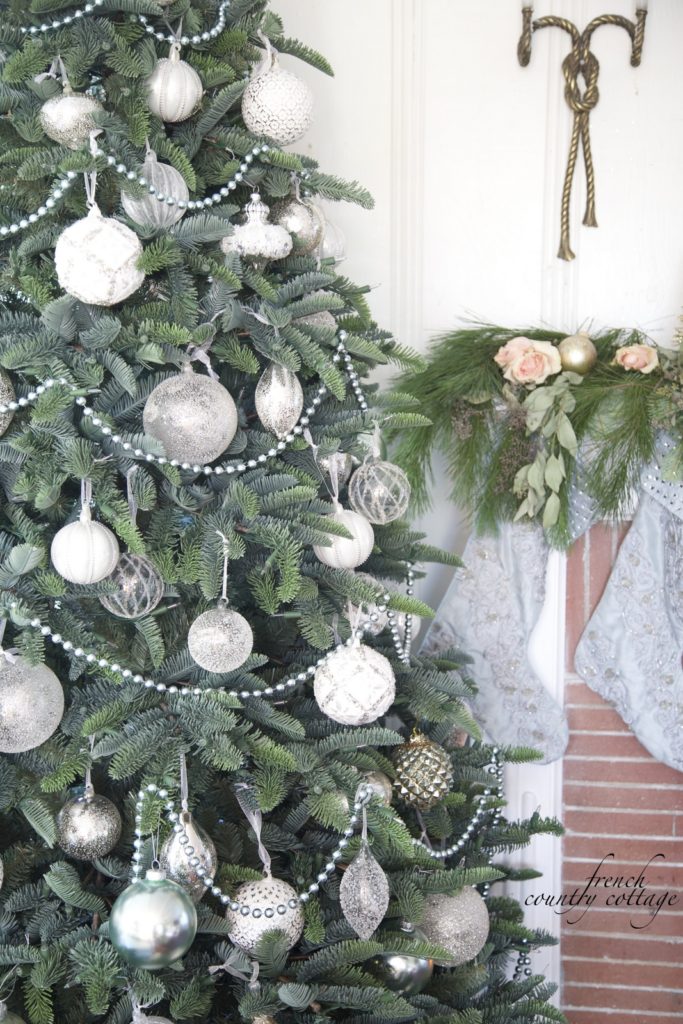 Christmas tree decorated with white and vintage ornaments