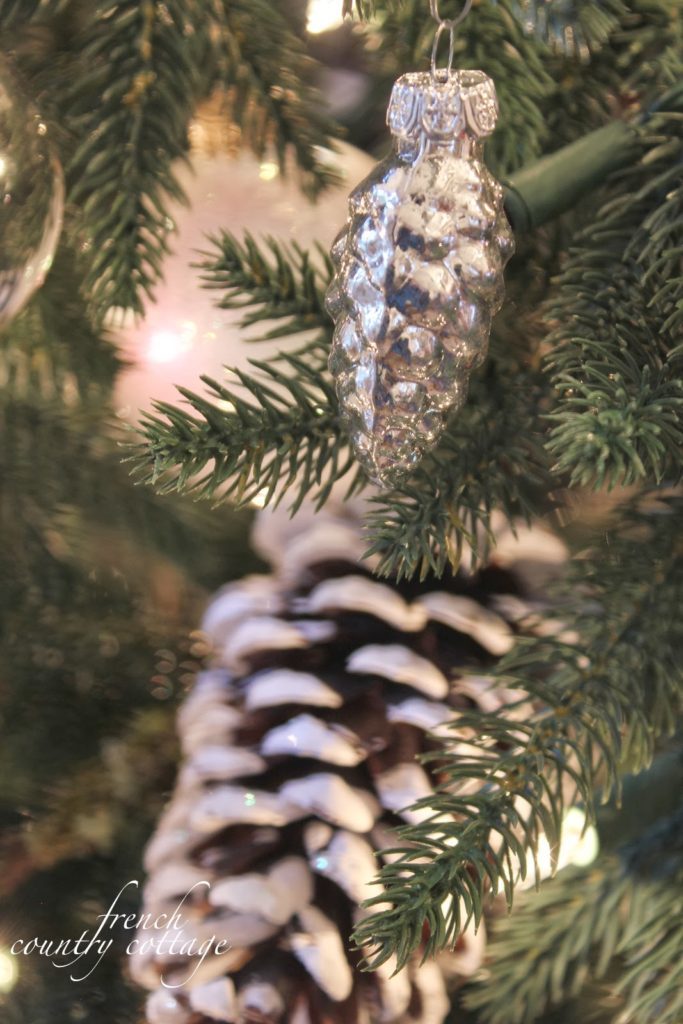 Close up of acorn ornaments hanging on Christmas tree
