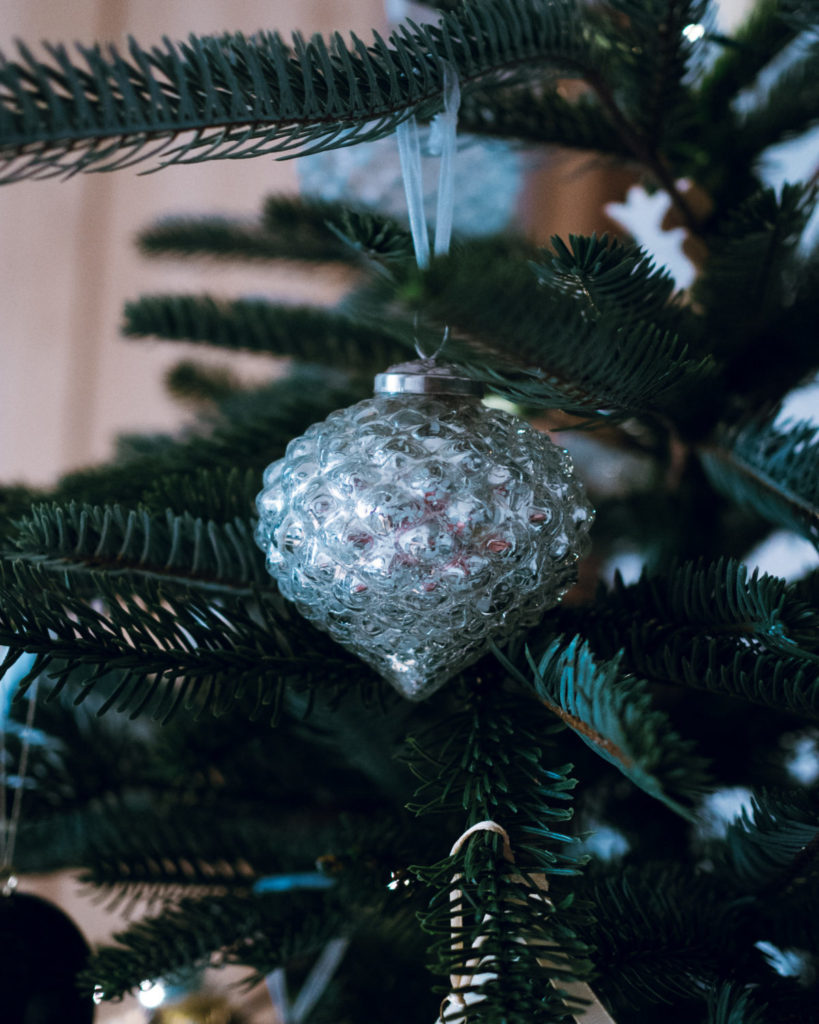 close-up of glass ornament on christmas tree