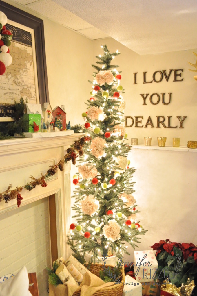 pre-lit artificial christmas tree with wool garland and pom-pom decor