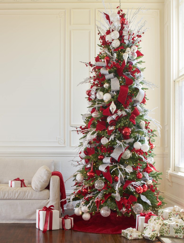 full shot of artificial Christmas tree decorated with red, white, and silver ornaments