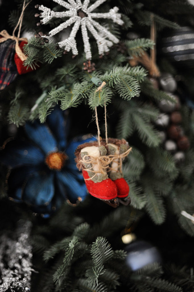 Close-up of vintage-inspired boots ornament on Christmas tree