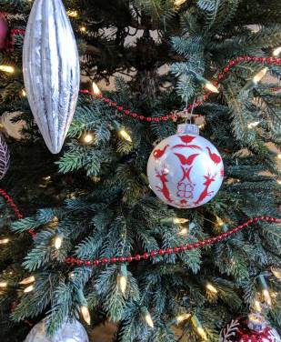 White and red ornaments on tree