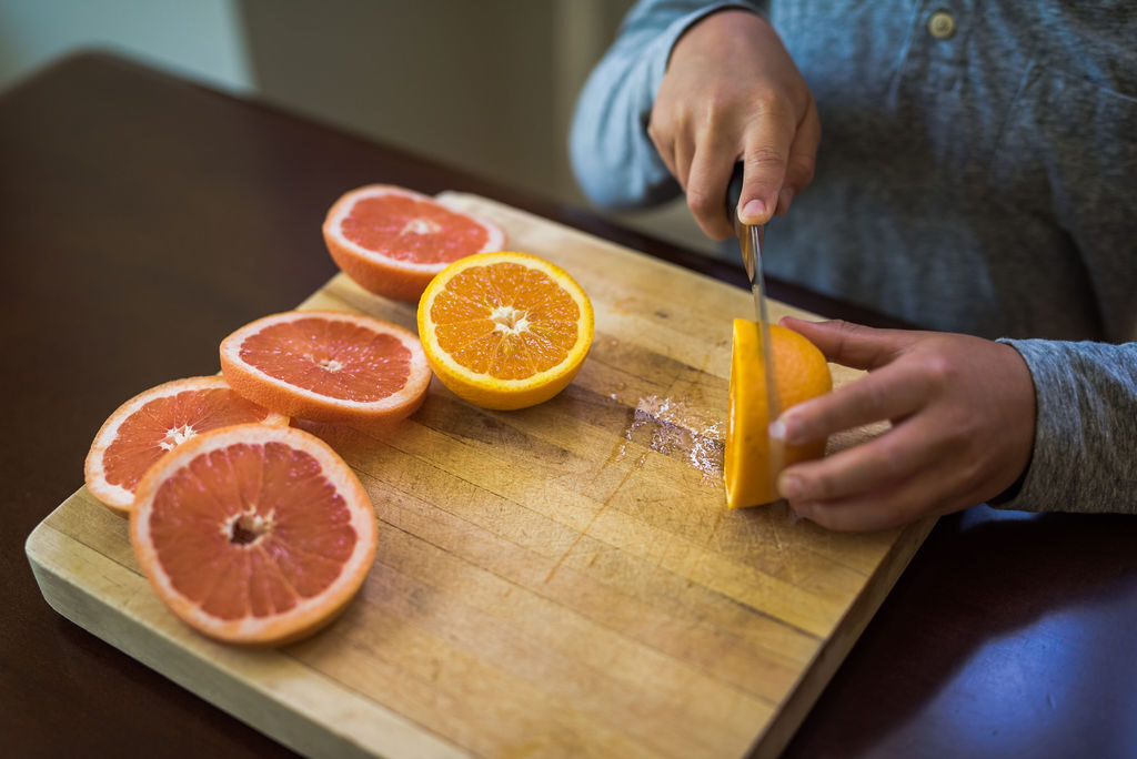 cutting oranges and grapefruit