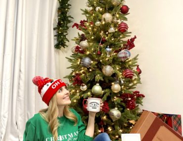 Jen Lilley with a Balsam Hill Christmas tree decorated with Farmhouse Christmas ornaments