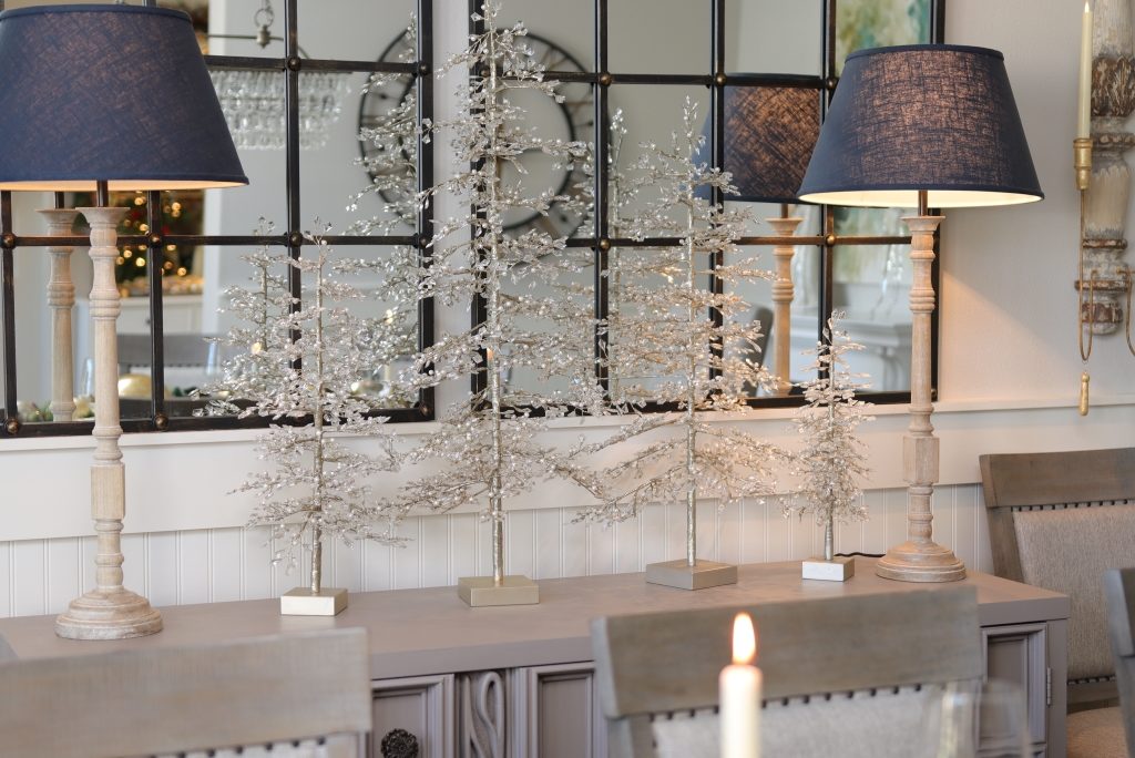 Balsam Hill Crystal and Pearl accent trees on top of a buffet table in the dining room