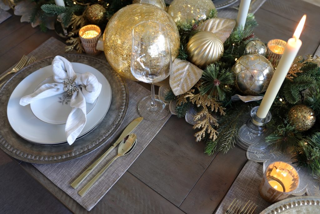 Champagne and gold Christmas table decorations and place settings