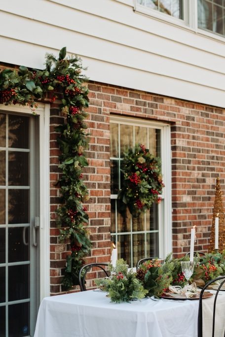 Christmas wreaths, garlands, and light sculptures as Christmas outdoor patio decor