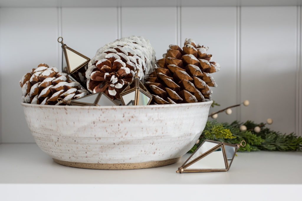 Geometric glass ornamens with pinecones as repurposed Christmas home decor