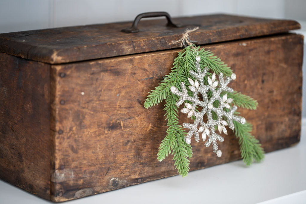 Snowflake ornament used as an accent for a wooden box