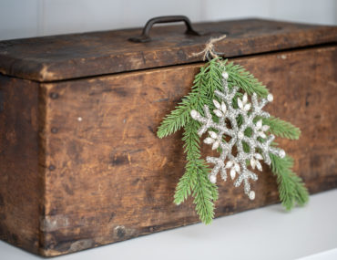Snowflake ornament used as an accent for a wooden box