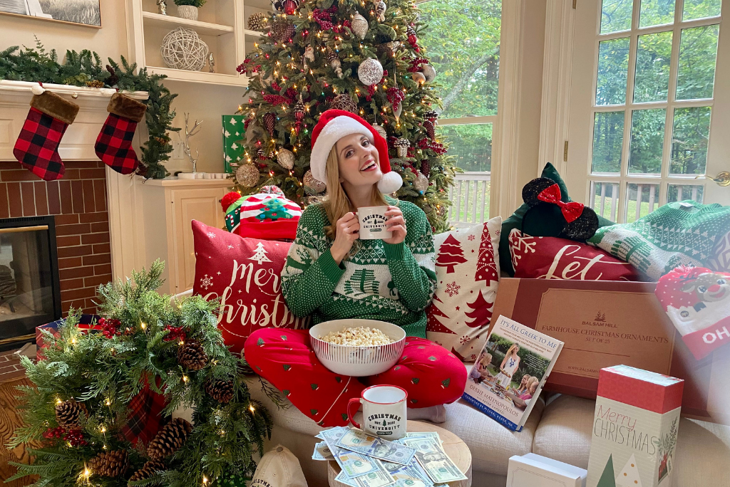 Jen Lilley sitting in front of a Christmas tree for Christmas is Not Cancelled