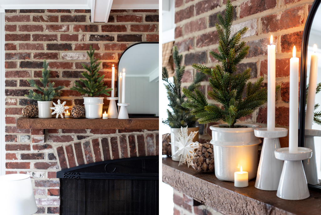 A brick mantel decorated with LED candles, snowflake cutouts, and tabletop trees used as repurposed Christmas decorations
