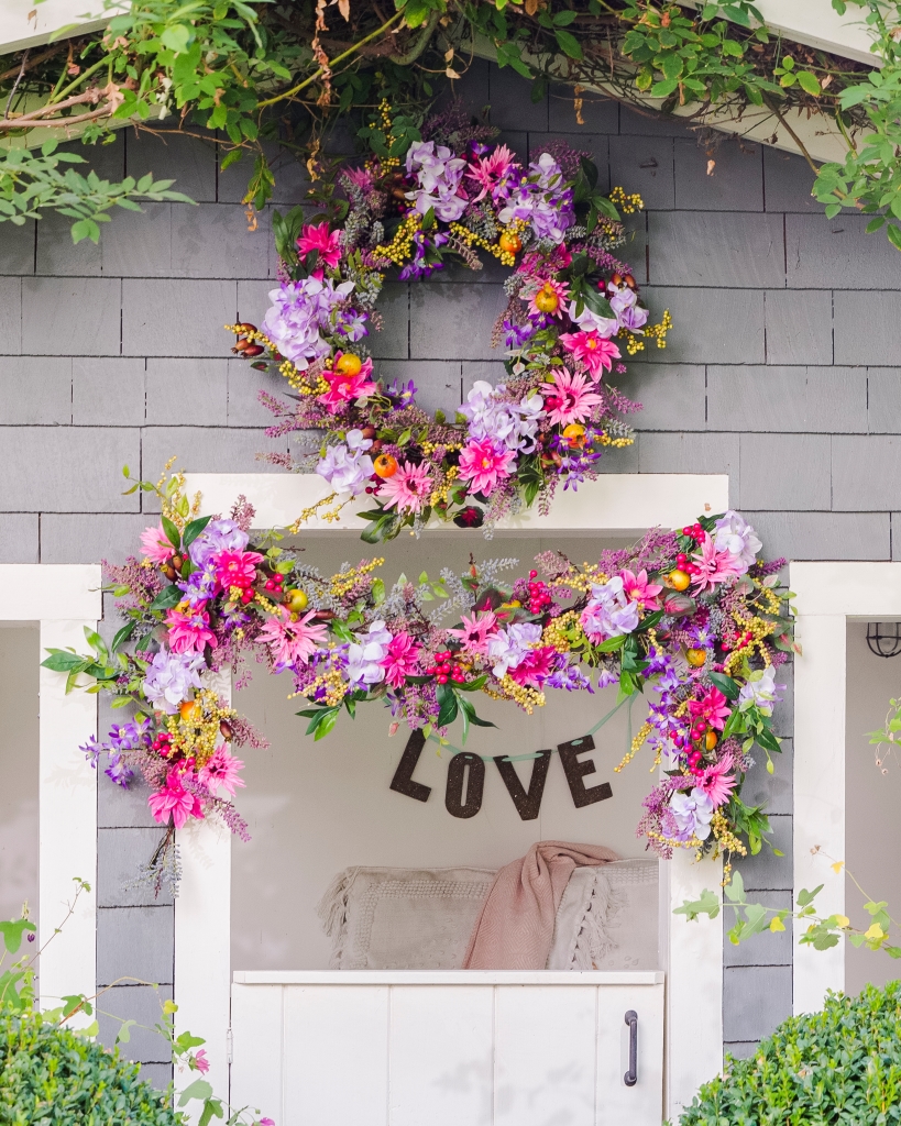 Purple and pink floral wreath and garland in a she shed