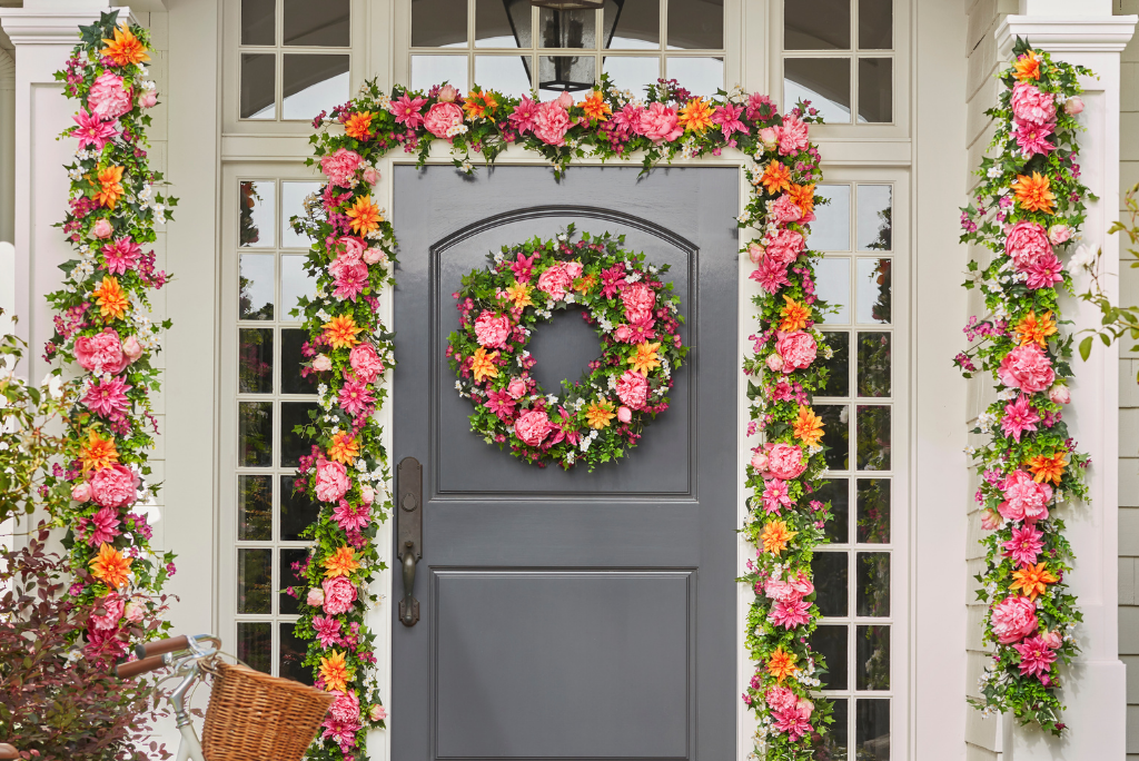 Artificial floral wreath and garlands on front door