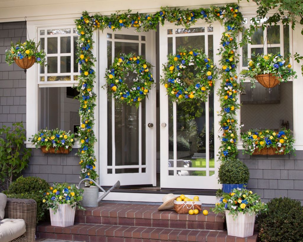 Yellow and blue floral wreaths and garlands on doors and windows