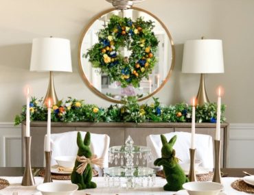 Blue and yellow floral wreath and garland on a dining room sideboard mirror