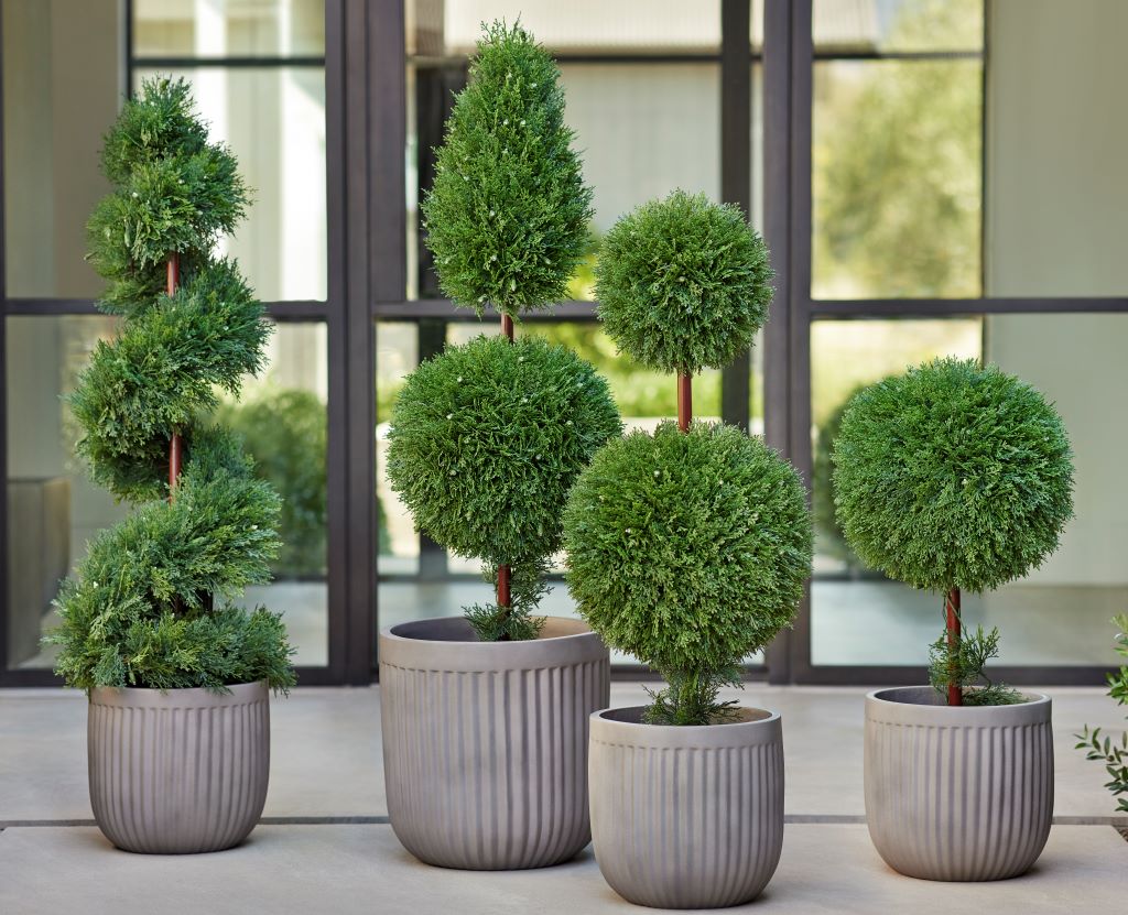 Cypress artificial topiary in spiral, finial, double ball, and single ball shapes