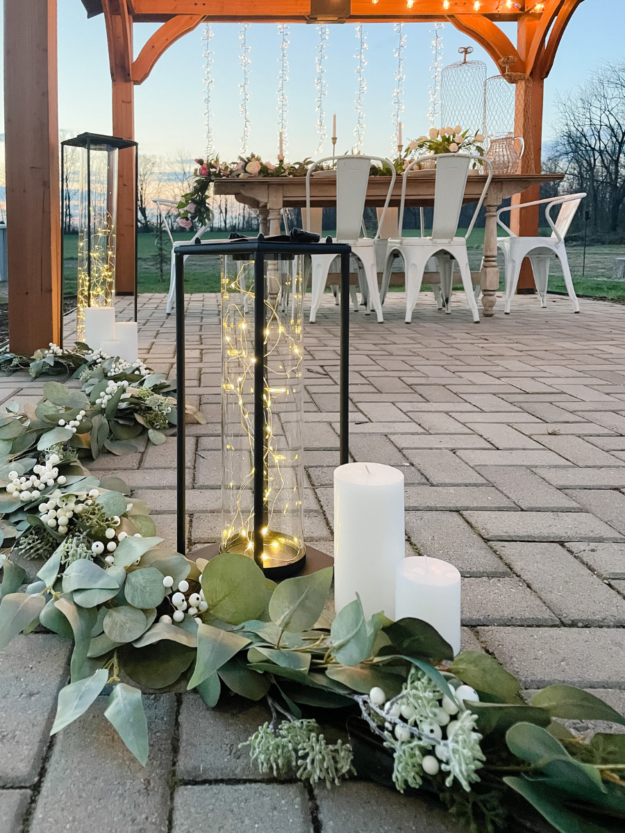 Fairy light lanterns and LED candles as wedding outdoor decorations