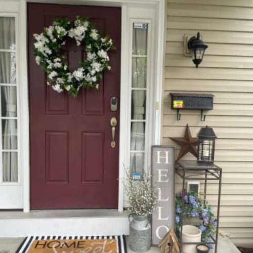 Balsam Hill Outdoor White Rhapsody Wreath hung on front door porch