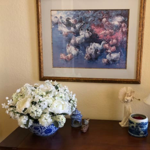 Balsam Hill Southern Charm white flowers arrangement set on blue and white vase on top of a table