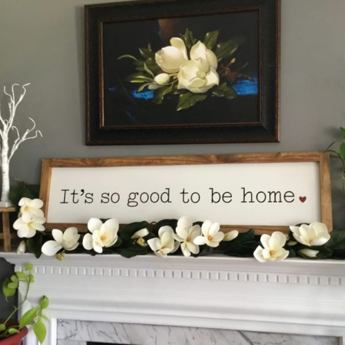 Balsam Hill Spring Magnolia garland on mantel with magnolia painting on wall