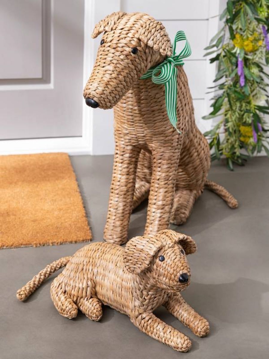 Woven seagrass dog figures as spring home decoration for farmhouse theme