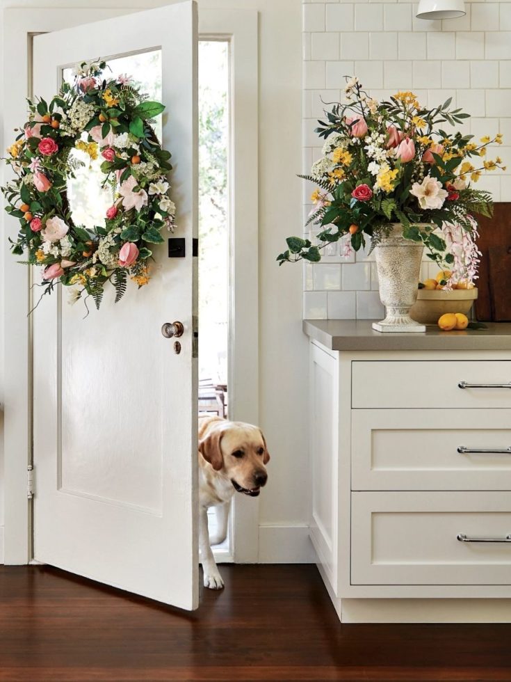 Tulip wreath and floral arrangement as spring home decorations